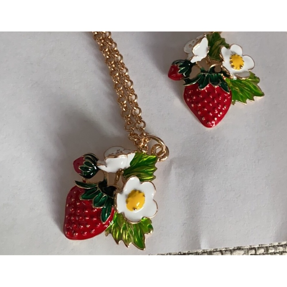 Two strawberry enameled necklaces